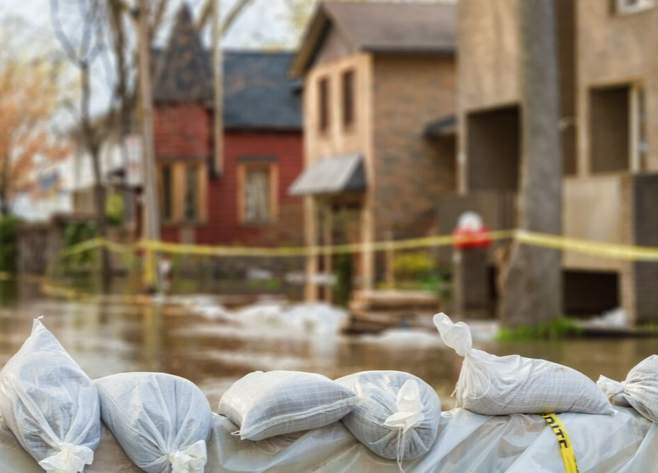 flooded homes with sandbags